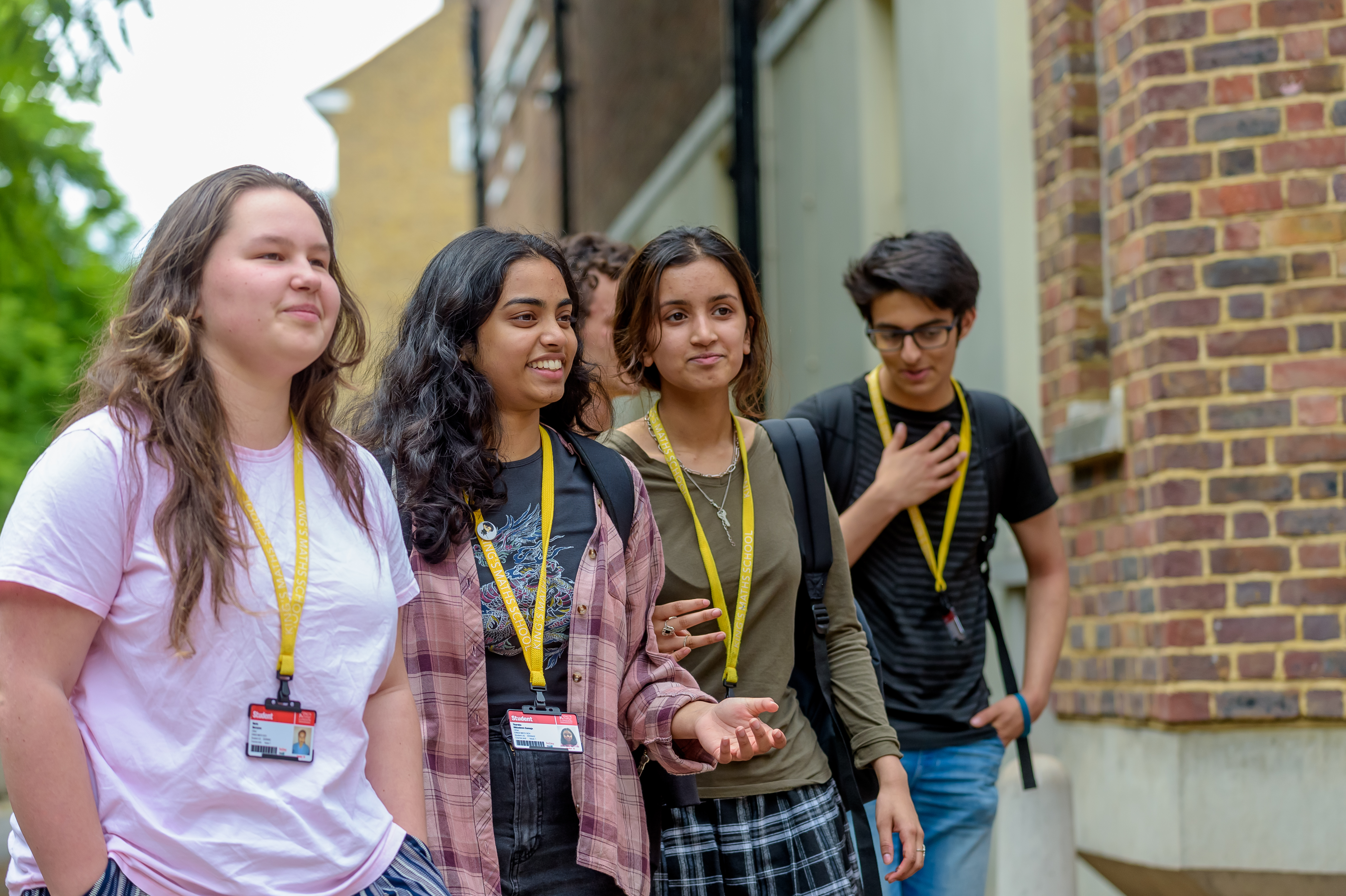 Smiling girls students prospectus front page