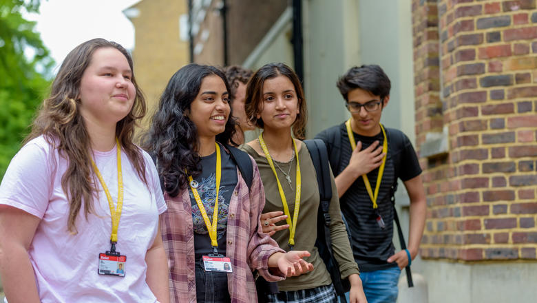 Smiling girls students prospectus front page
